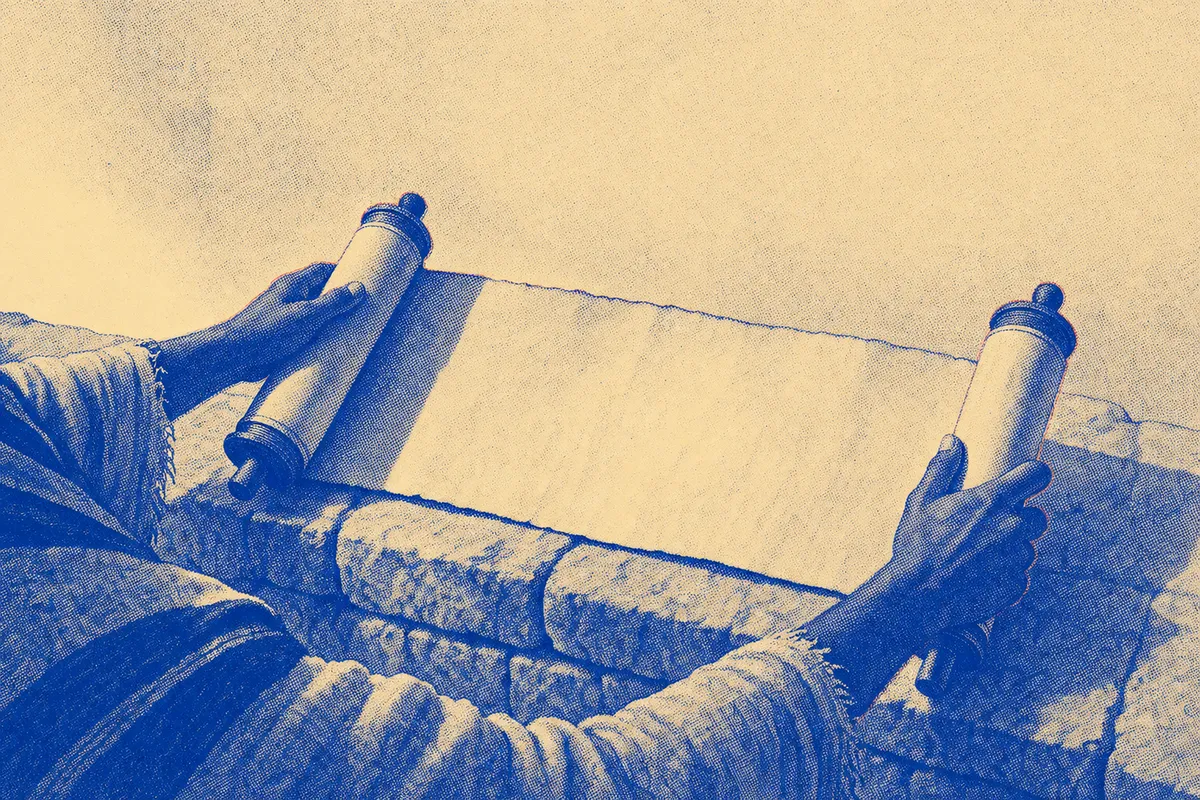 A hand holding an open scroll