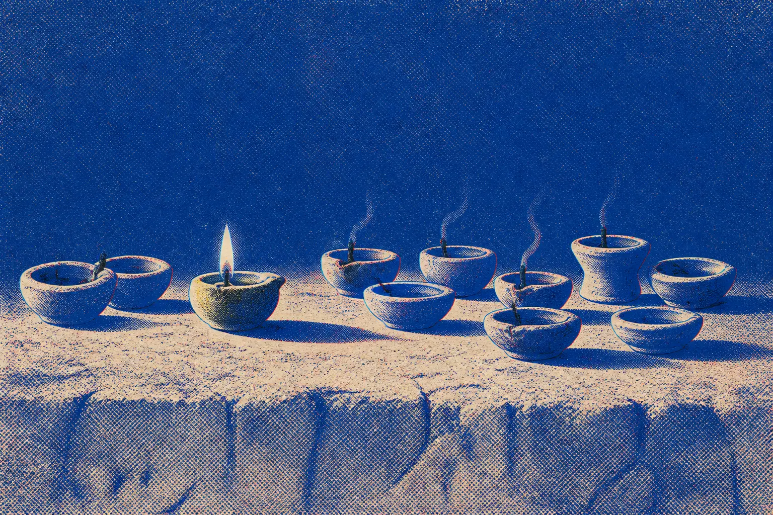 Ten small clay oil lamps in an uneven row on packed earth at night, nine wicks dark or smoking, one still carrying a small flame and casting the only shadow
